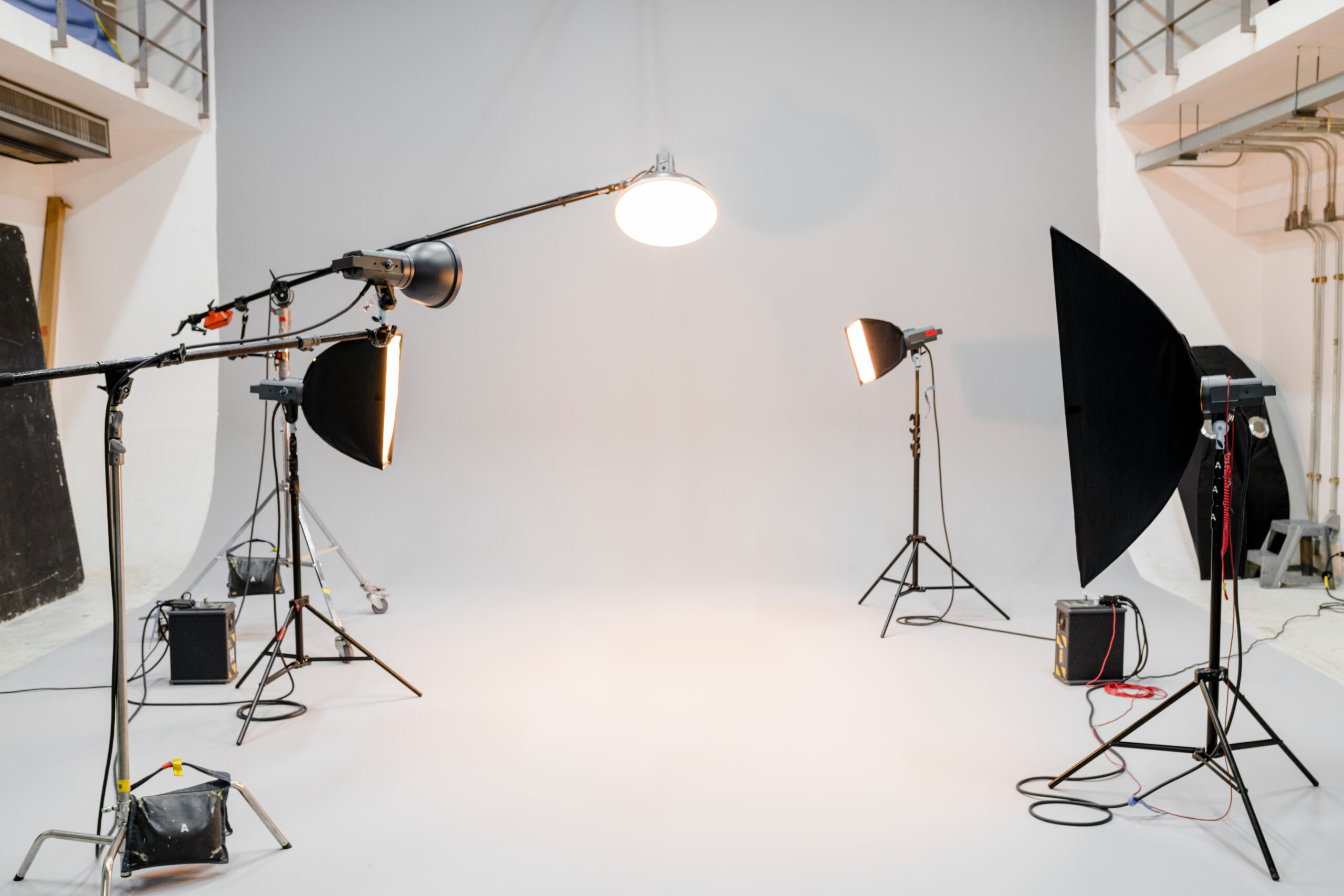 Empty backdrop in photo studio studio with photography lighting equipment.